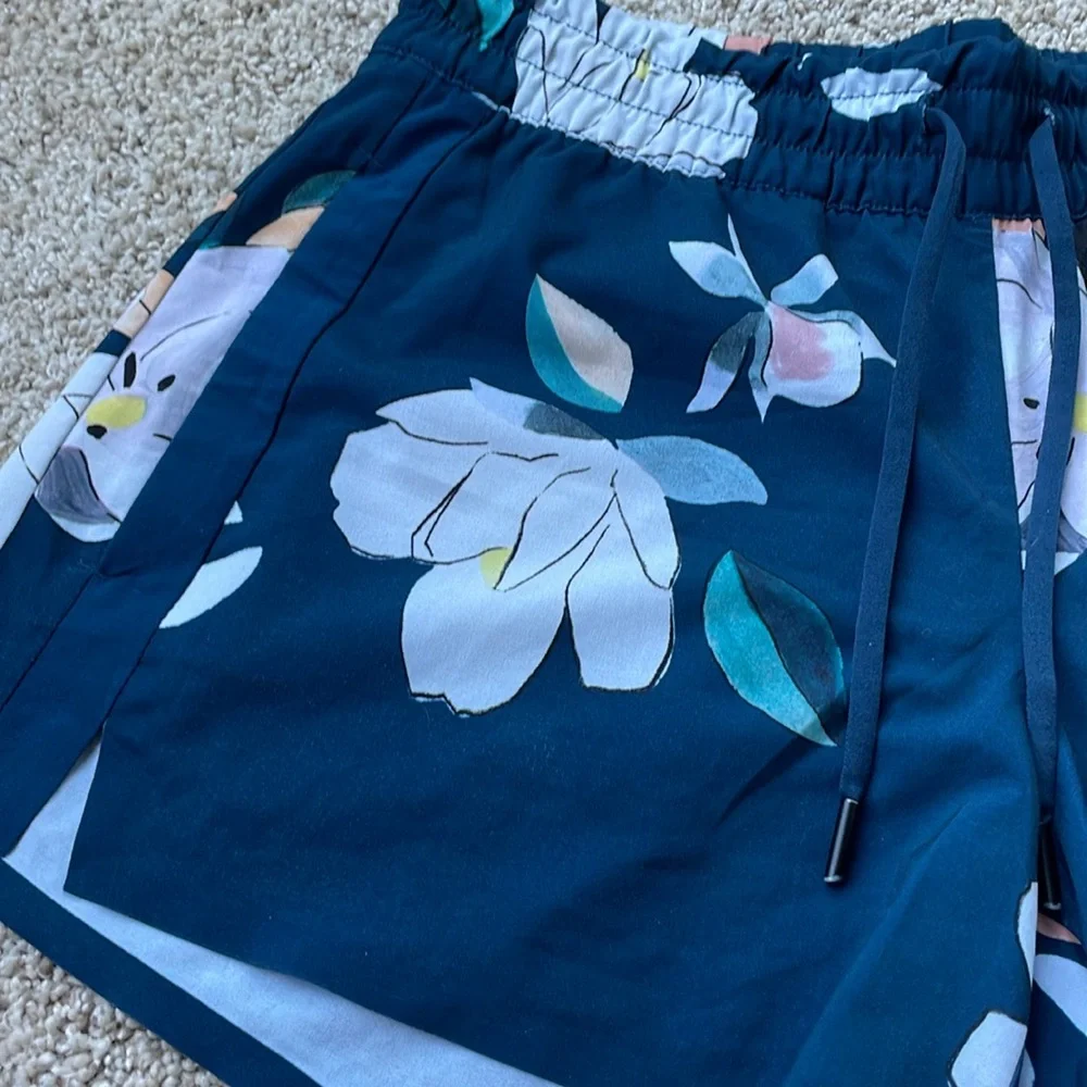 Athleta Baja Blue Floral Shorts - Picture 2 of 6